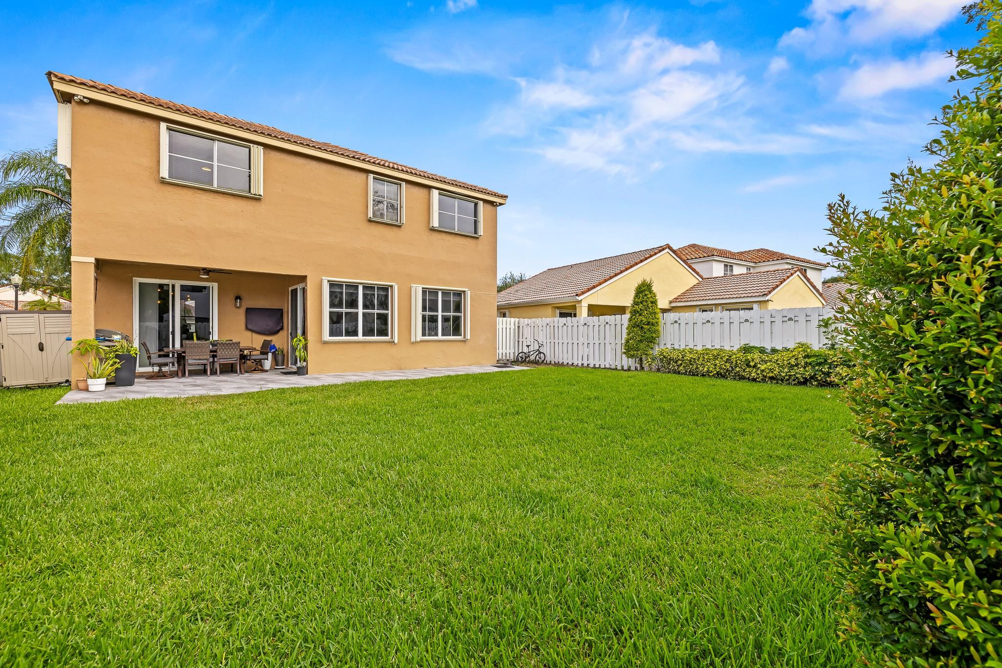 695 Falling Water Road Weston, FL 33326 - Photo 20 of 31 a view of a house with a backyard