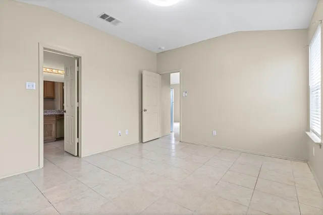 an empty room with a bathroom