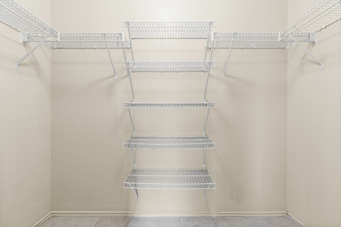 317 Tudor House Road Pflugerville, TX 78660 - Photo 14 of 28 a view of a room with racks on the wall