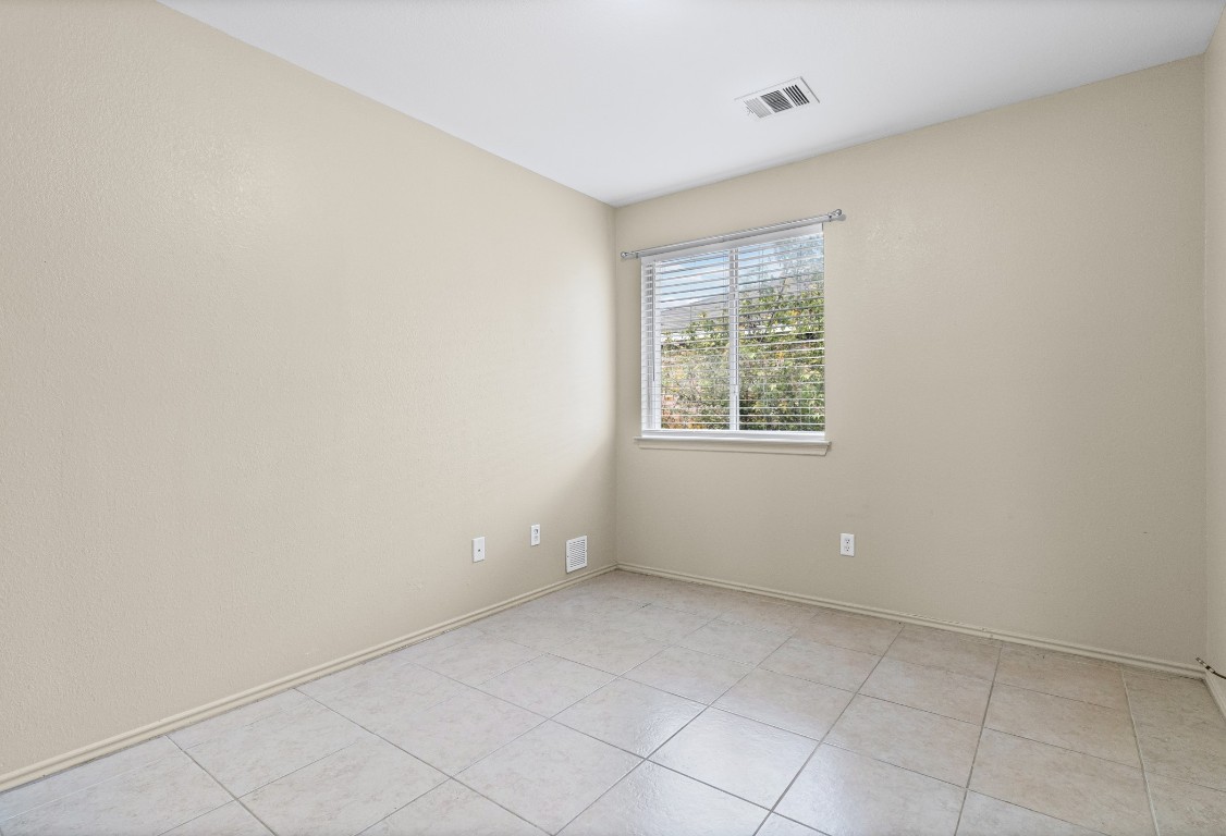 317 Tudor House Road Pflugerville, TX 78660 - Photo 15 of 28 an empty room with a window