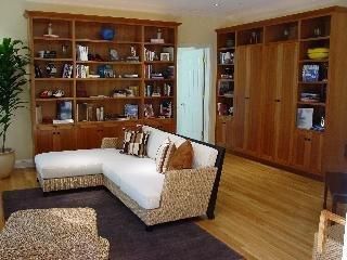 a living room with furniture and walk in closet