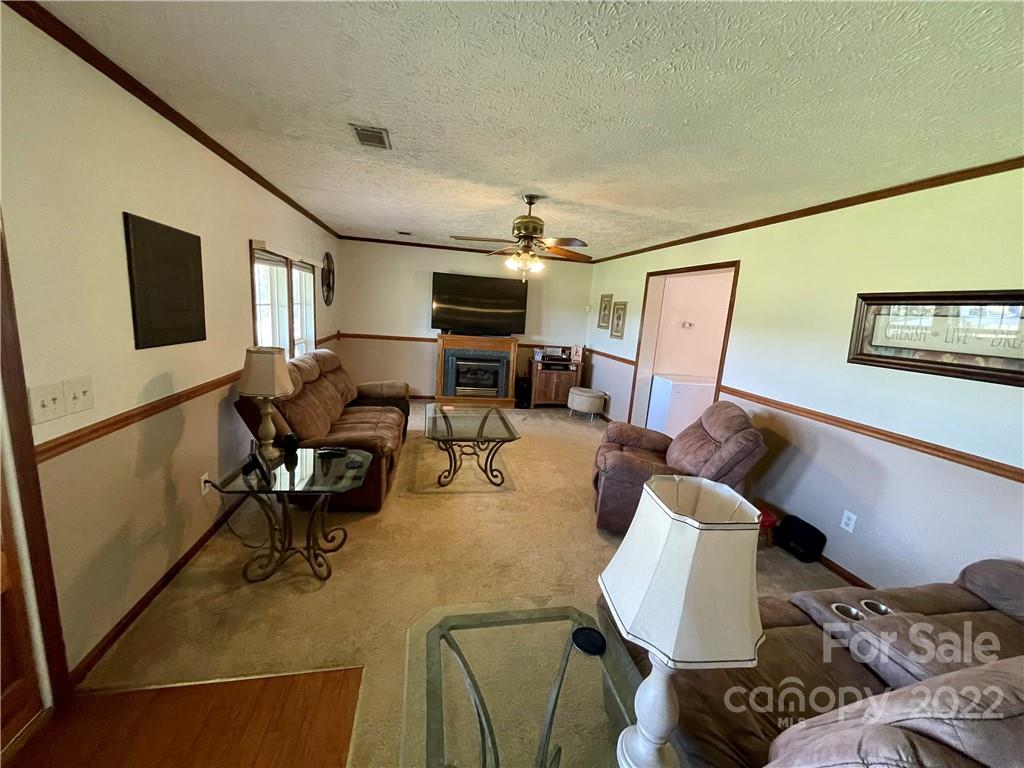 353 Duncan Road Rutherfordton, NC 28139 - Photo 13 of 42 a living room with furniture and a flat screen tv