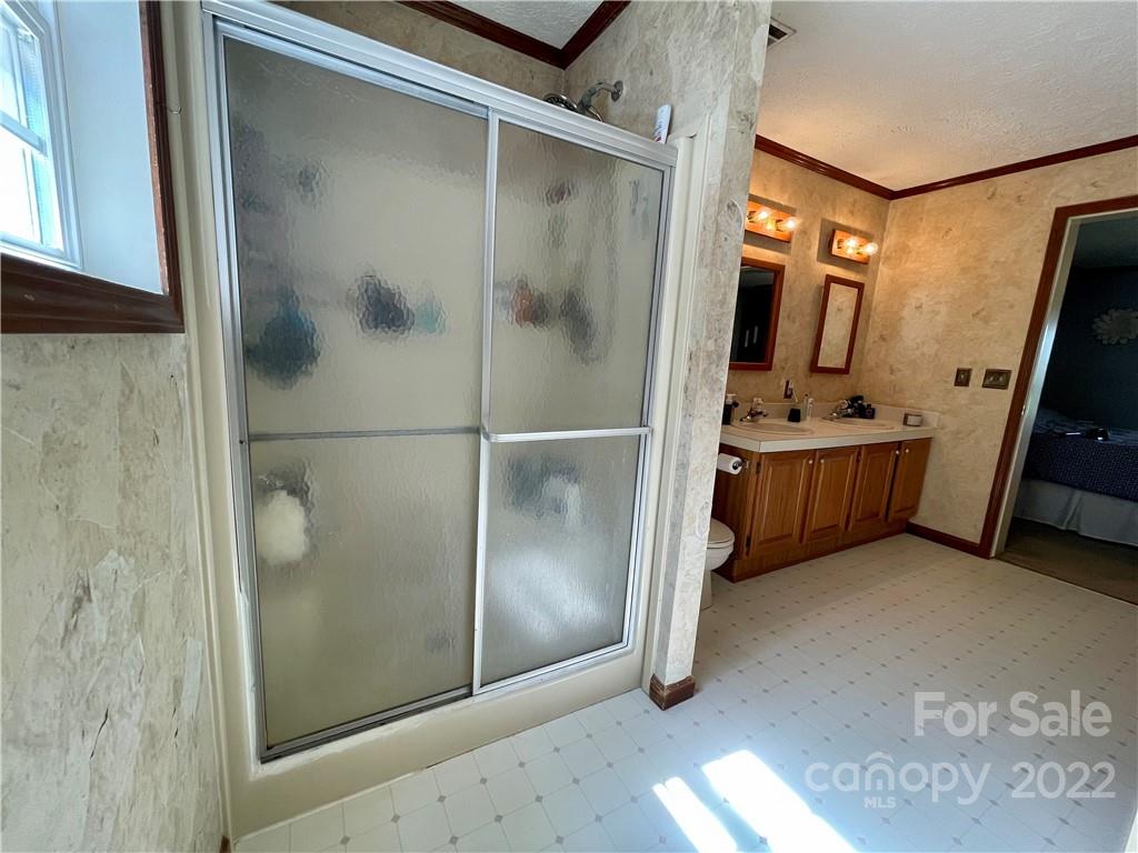 353 Duncan Road Rutherfordton, NC 28139 - Photo 19 of 42 a bathroom with a tub and shower