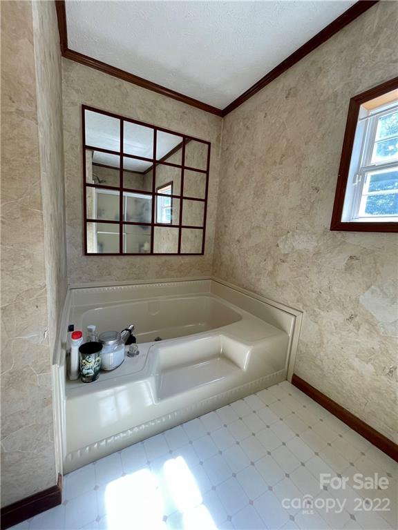 353 Duncan Road Rutherfordton, NC 28139 - Photo 23 of 42 a bathroom with a tub and a window