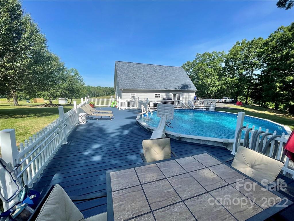 353 Duncan Road Rutherfordton, NC 28139 - Photo 31 of 42 a view of a patio with chairs and a table