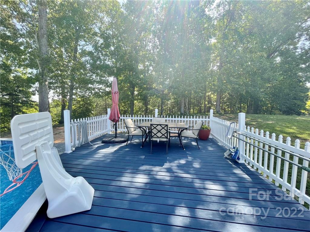 353 Duncan Road Rutherfordton, NC 28139 - Photo 32 of 42 a view of a chair and table on the wooden deck