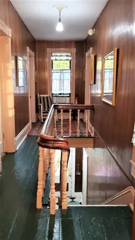 a brick building with trees in front of it