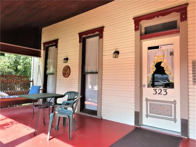a dining room with furniture and a window