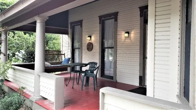 a view of living room filled with furniture and window