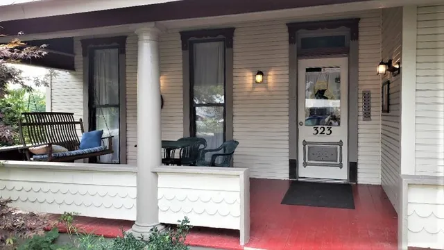 a view of a house with a backyard