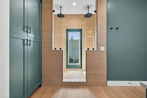 a view of empty room with wooden floor