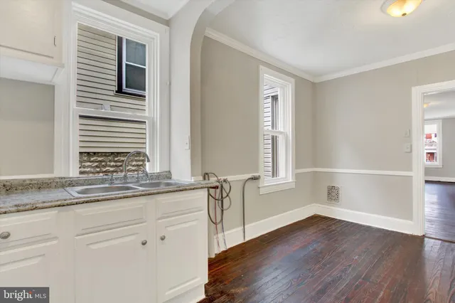 a view of a kitchen cabinets and wooden floor