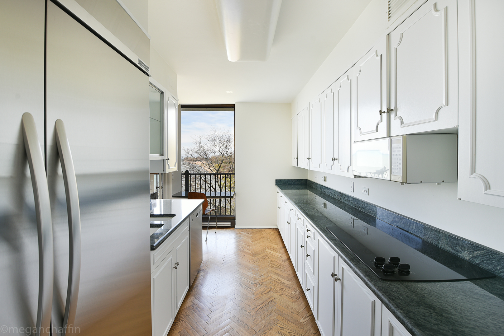 1420 Sheridan Road, Unit 6B Wilmette, IL 60091 - Photo 11 of 23 a kitchen with stainless steel appliances granite countertop a refrigerator a sink and a stove
