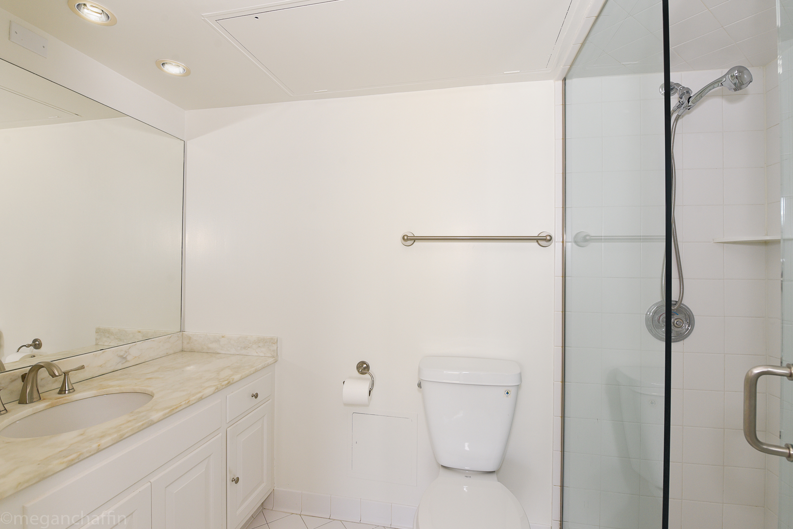 1420 Sheridan Road, Unit 6B Wilmette, IL 60091 - Photo 18 of 23 a bathroom with a granite countertop sink vanity mirror and toilet