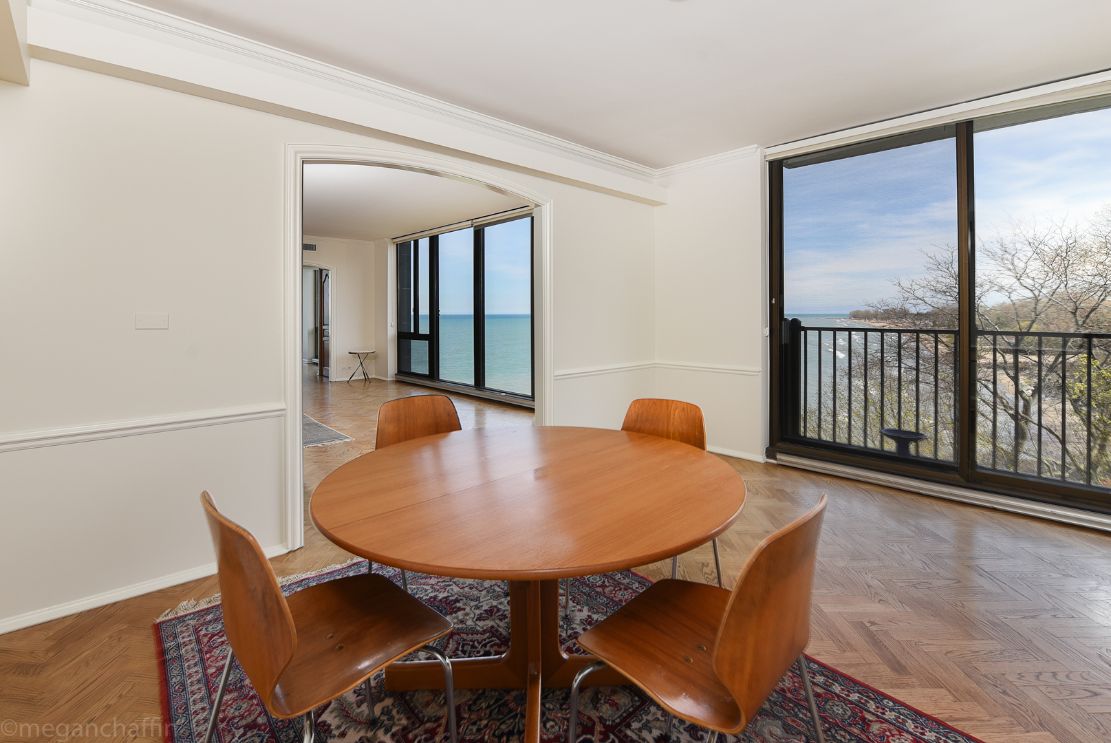 1420 Sheridan Road, Unit 6B Wilmette, IL 60091 - Photo 9 of 23 a dining room with furniture and wooden floor