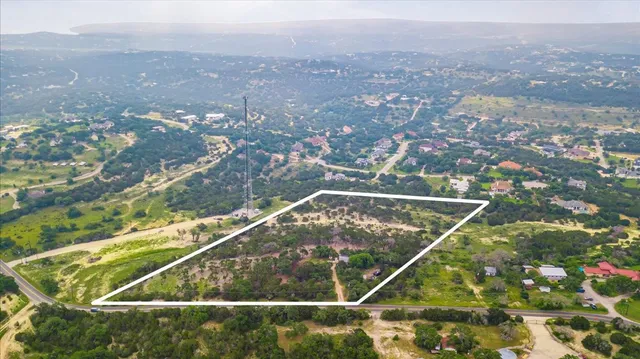 a view of a barn house in the middle of a yard