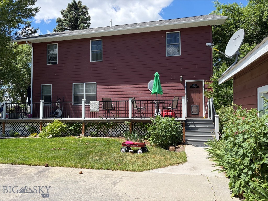 East facing side of house with side door entry.