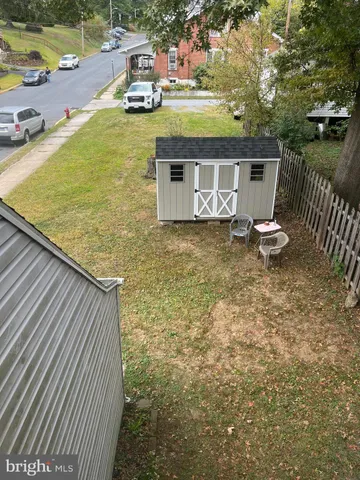swimming pool view with a seating space
