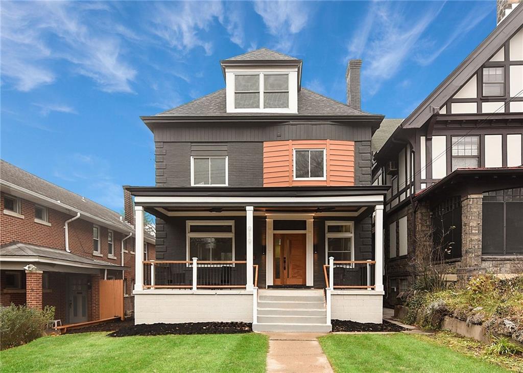 front view of a house with a yard
