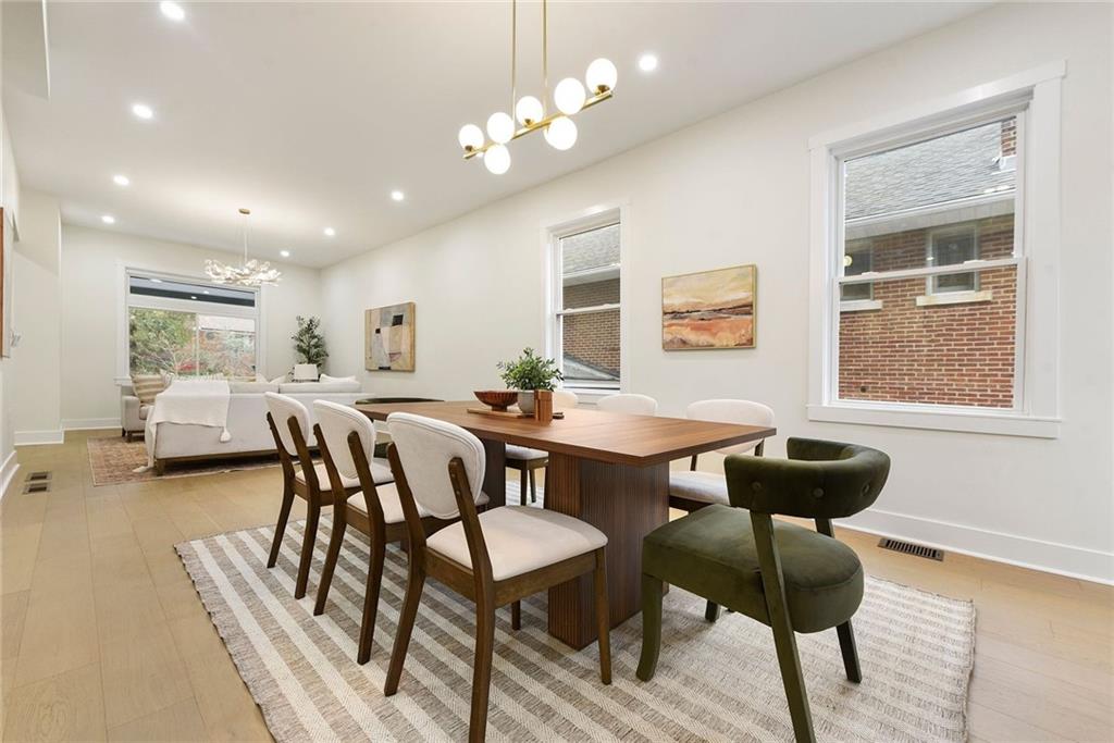 919 Heberton Street Pittsburgh, PA 15206 - Photo 14 of 49 a view of a dining room with furniture and wooden floor
