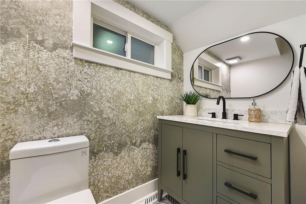 919 Heberton Street Pittsburgh, PA 15206 - Photo 25 of 49 a bathroom with a toilet sink and mirror