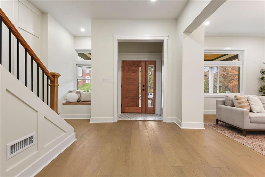919 Heberton Street Pittsburgh, PA 15206 - Photo 3 of 49 a view of an entryway with wooden floor and a livingroom
