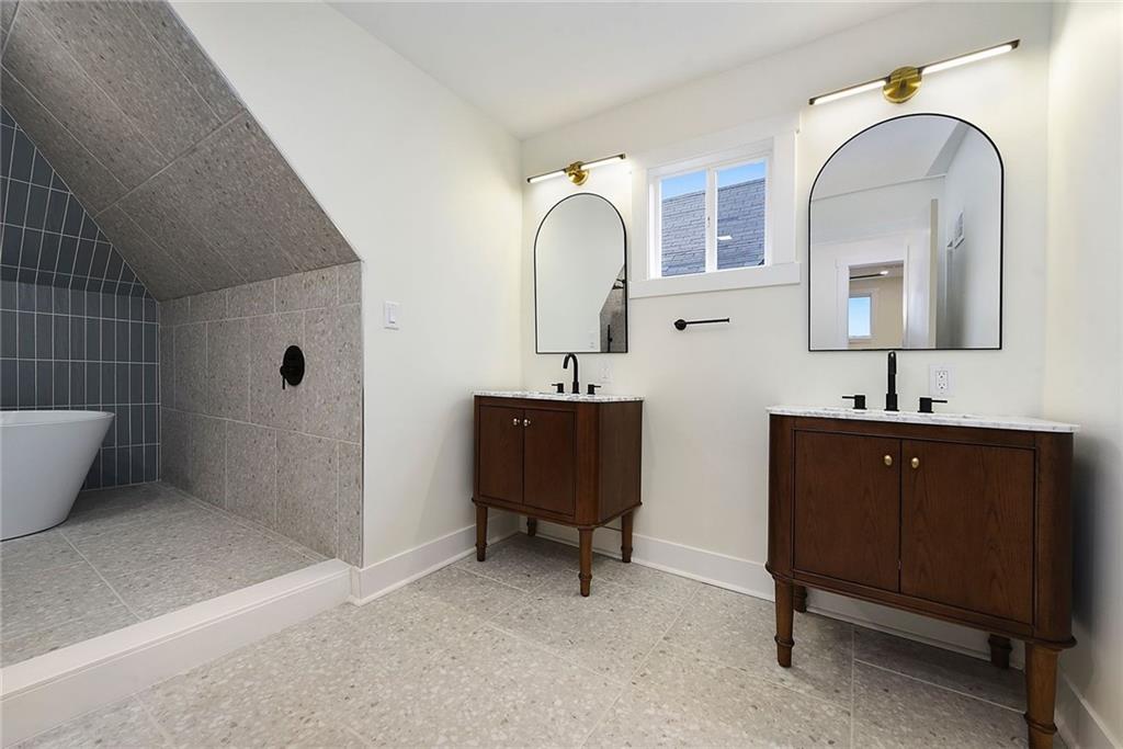 919 Heberton Street Pittsburgh, PA 15206 - Photo 46 of 49 a bathroom with 2 sink and a mirror