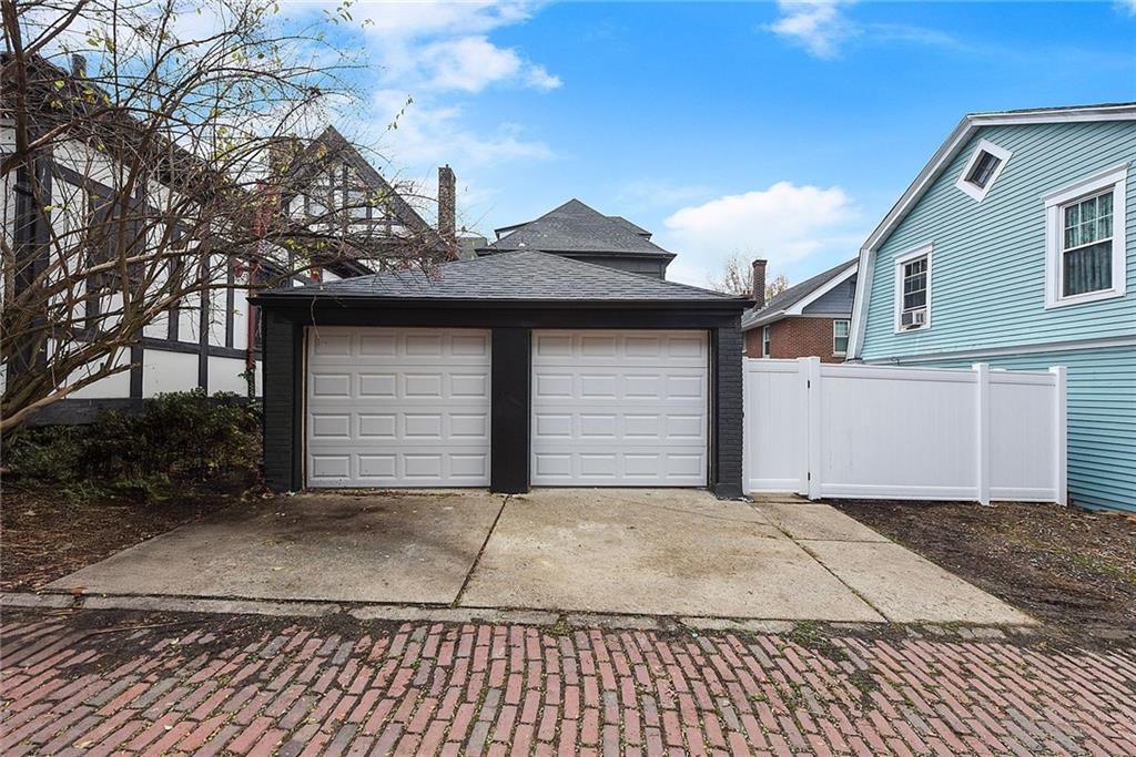 919 Heberton Street Pittsburgh, PA 15206 - Photo 49 of 49 a front view of a house with a yard and garage