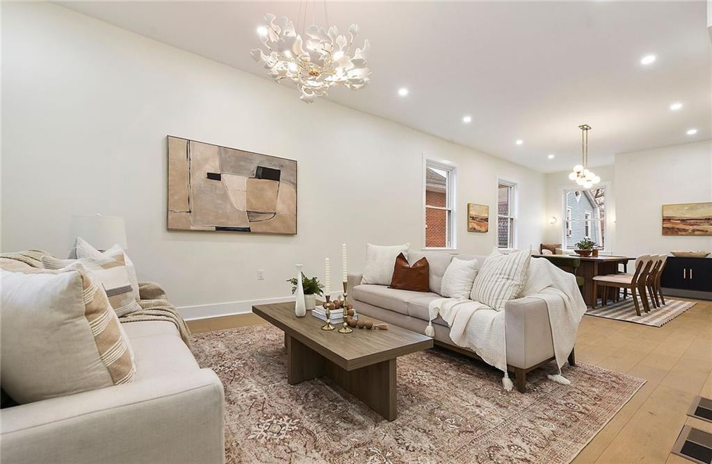 919 Heberton Street Pittsburgh, PA 15206 - Photo 8 of 49 a living room with furniture chandelier and a table