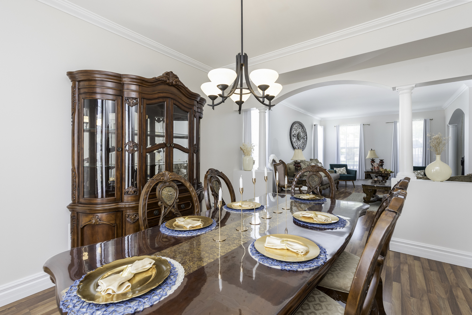 1650 Natures Way Lindenhurst, IL 60046 - Photo 13 of 55 a dining room with wooden floor a chandelier a wooden table and chairs