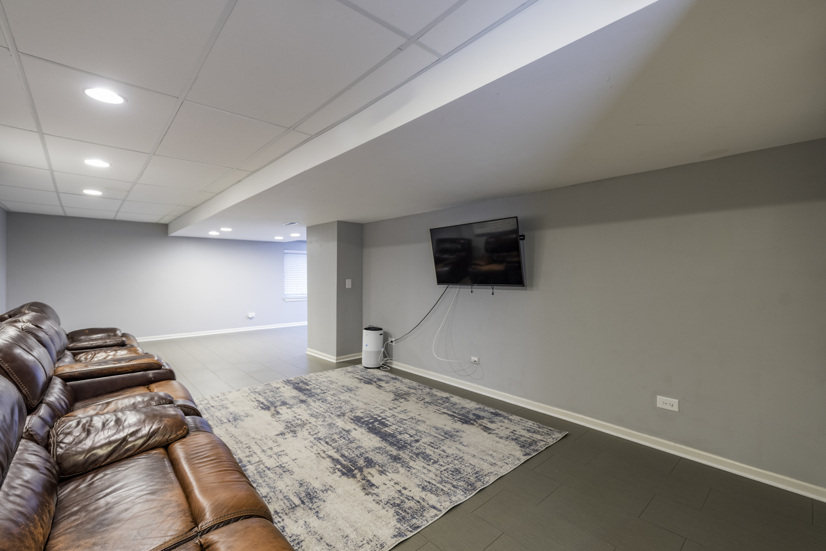 1650 Natures Way Lindenhurst, IL 60046 - Photo 38 of 55 a living room with a couch and a flat screen tv