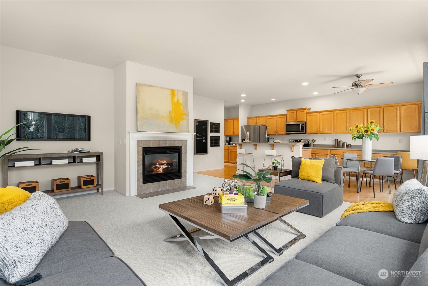 554 Rosario Avenue Northeast Renton, WA 98059 - Photo 13 of 38 a living room with furniture and a fireplace