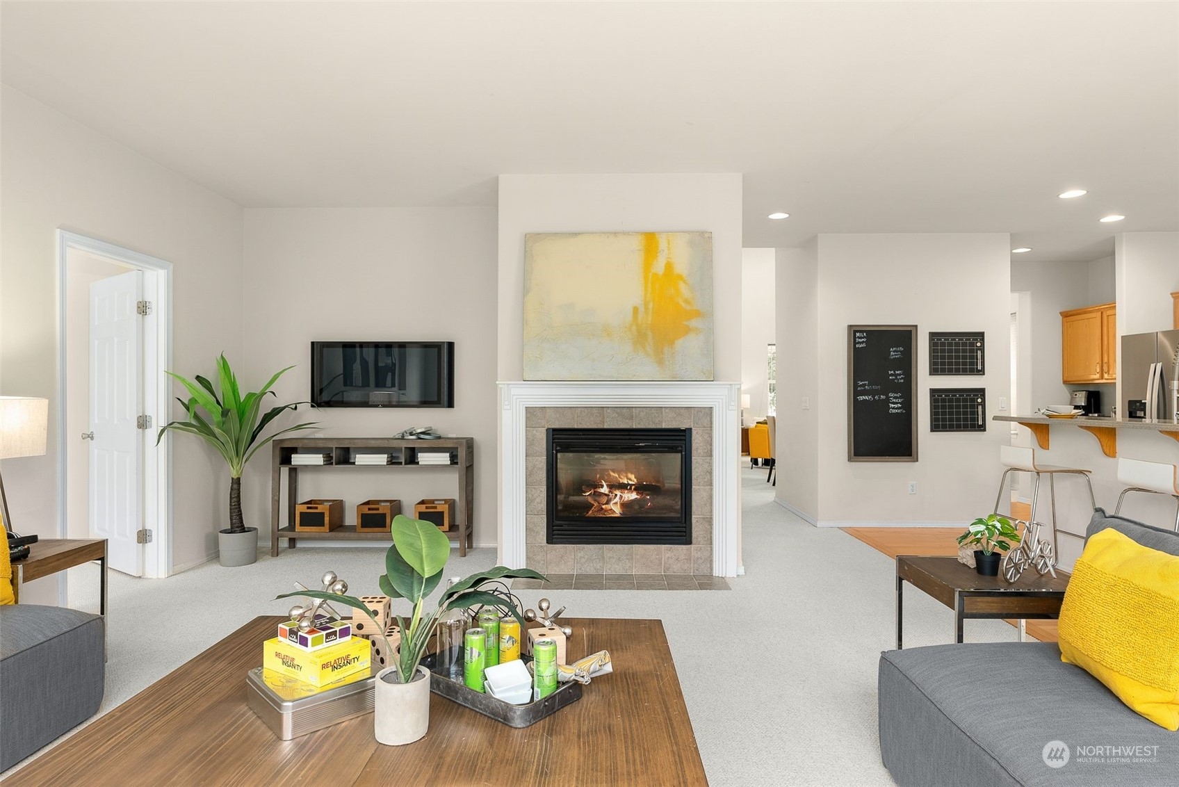 554 Rosario Avenue Northeast Renton, WA 98059 - Photo 14 of 38 a living room with furniture and a fireplace