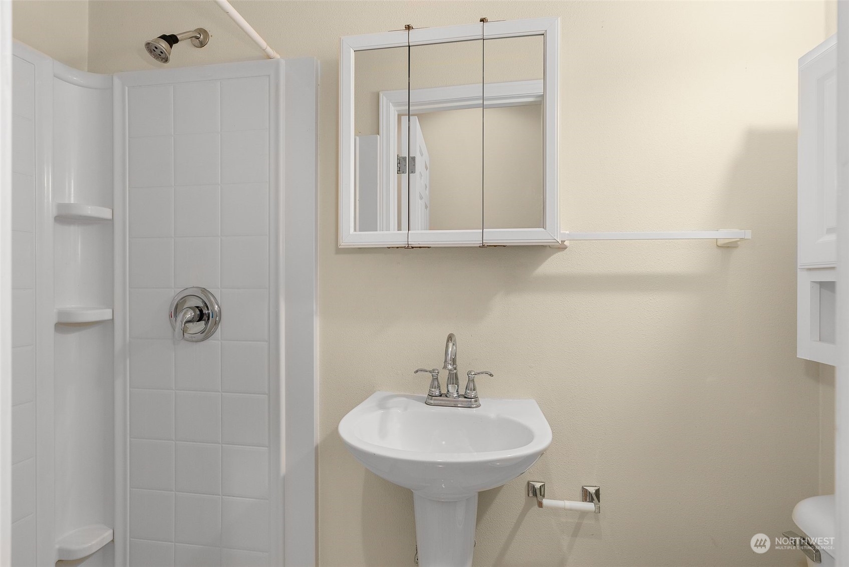 554 Rosario Avenue Northeast Renton, WA 98059 - Photo 17 of 38 a bathroom with a sink a toilet and mirror