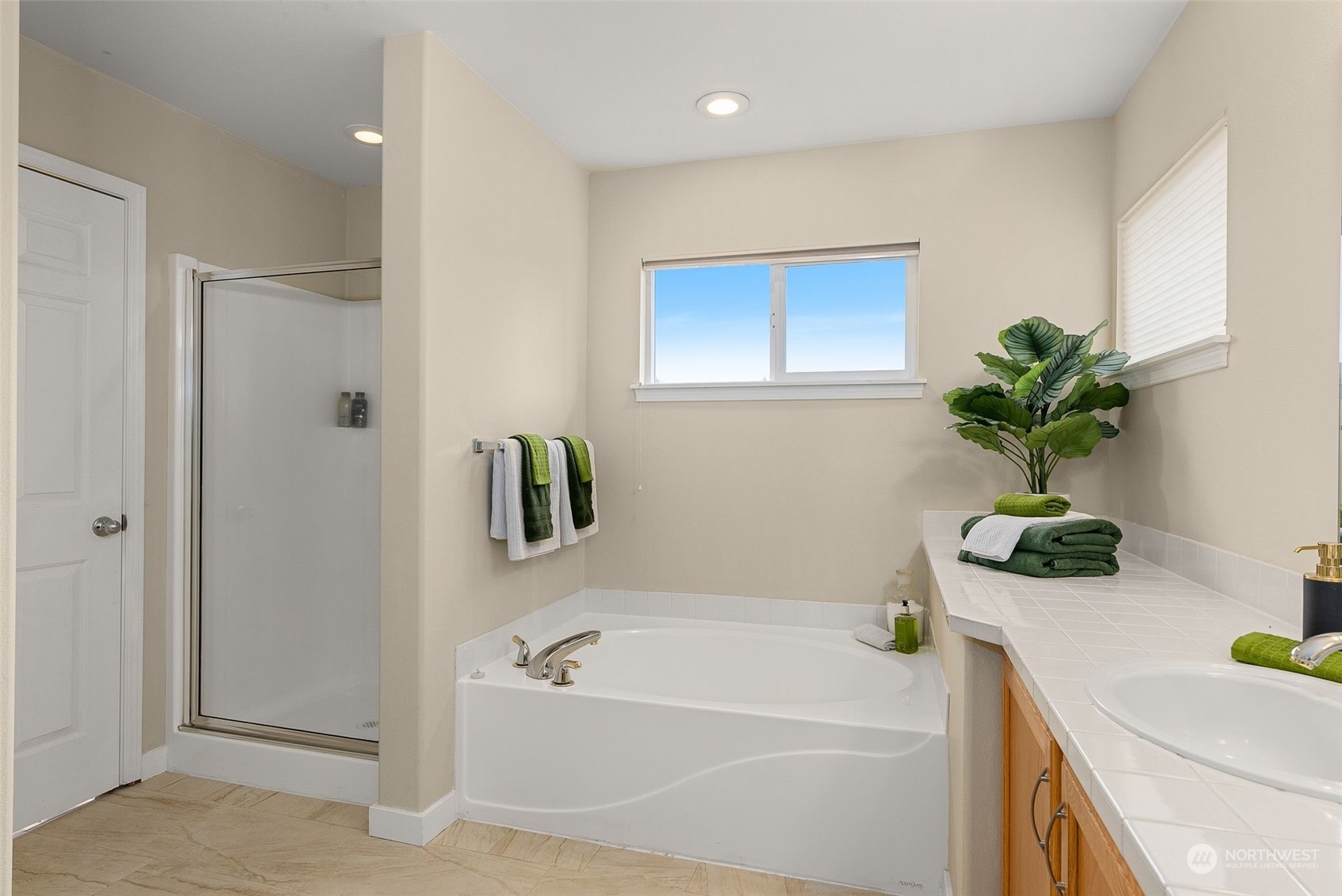 554 Rosario Avenue Northeast Renton, WA 98059 - Photo 22 of 38 a white bath tub sitting next to a white sink