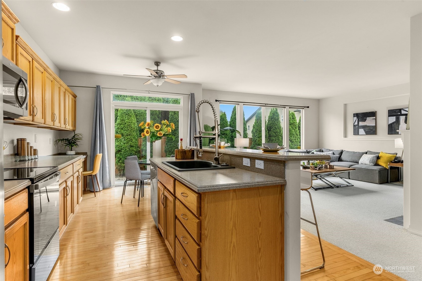 554 Rosario Avenue Northeast Renton, WA 98059 - Photo 6 of 38 a kitchen with sink stove and cabinets