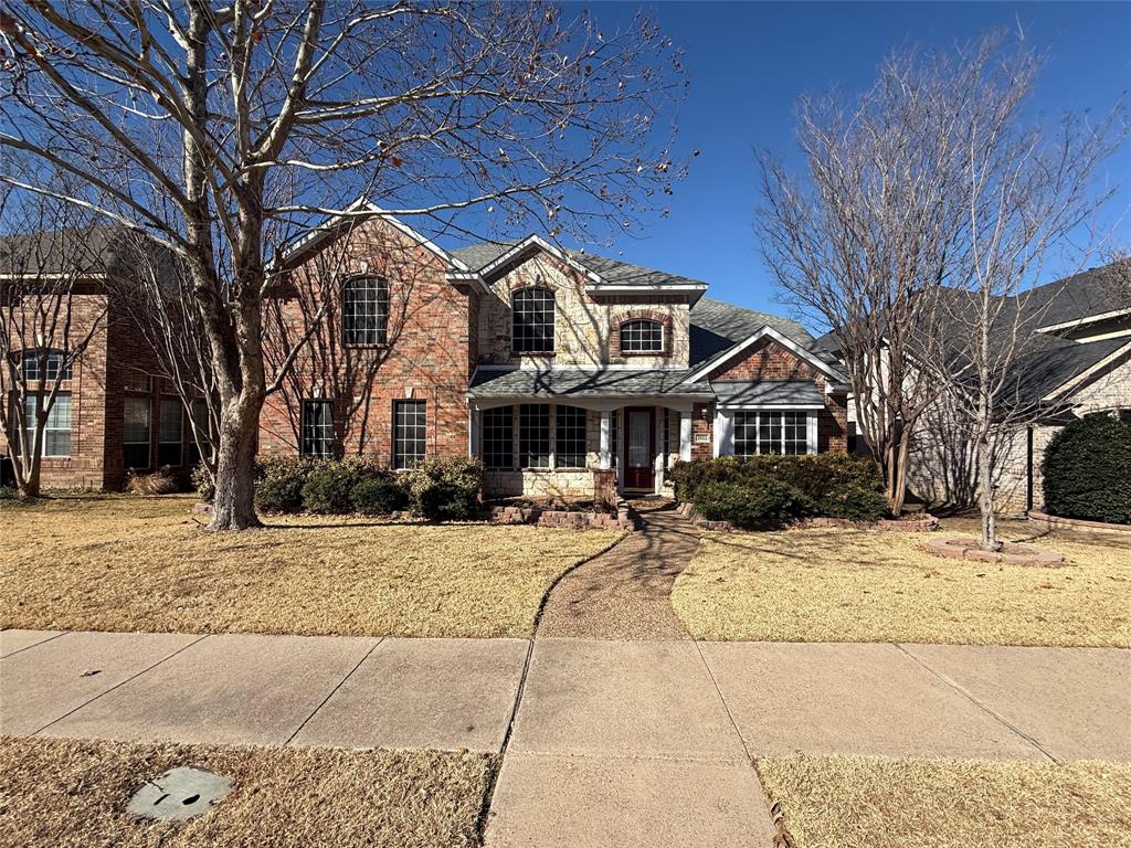 2022 Huntcliffe Court Allen, TX 75013 - Photo 1 of 40 Traditional-style home with a front lawn and brick siding