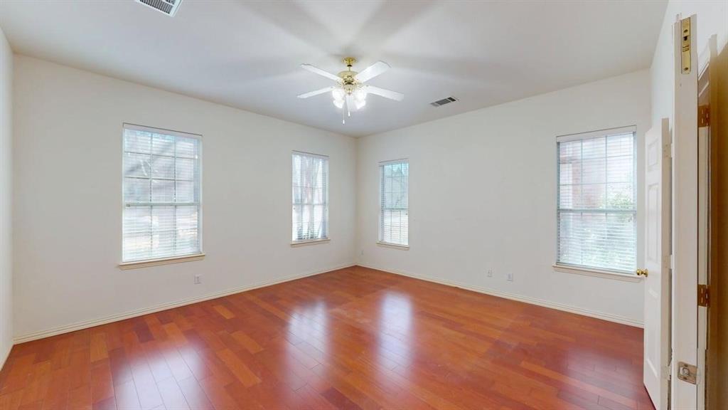 2022 Huntcliffe Court Allen, TX 75013 - Photo 10 of 40 Spare room featuring ceiling fan and wood-type flooring