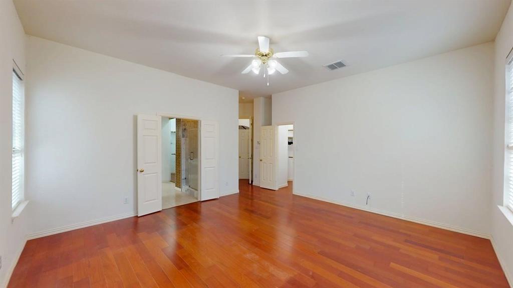2022 Huntcliffe Court Allen, TX 75013 - Photo 13 of 40 Unfurnished bedroom with wood finished floors and ceiling fan
