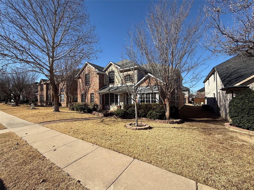 2022 Huntcliffe Court Allen, TX 75013 - Photo 2 of 40 Traditional-style house with brick siding