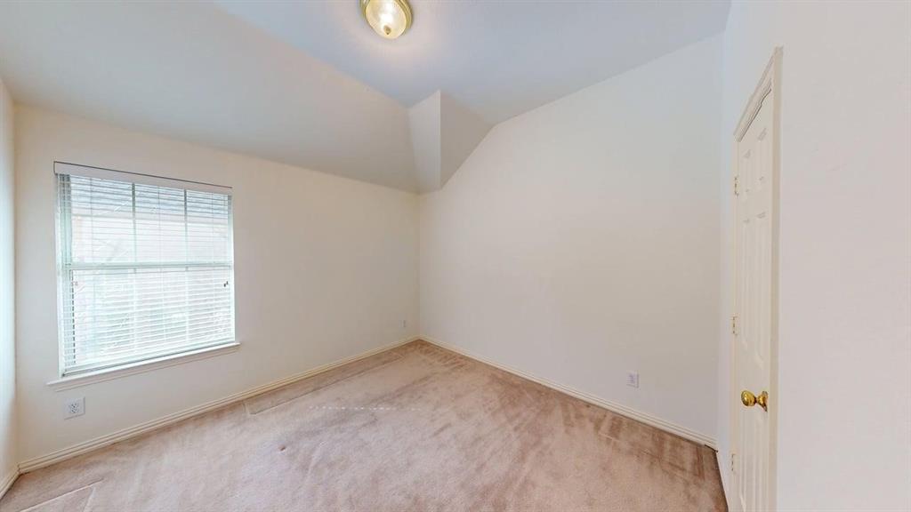 2022 Huntcliffe Court Allen, TX 75013 - Photo 21 of 40 Unfurnished room featuring carpet and vaulted ceiling