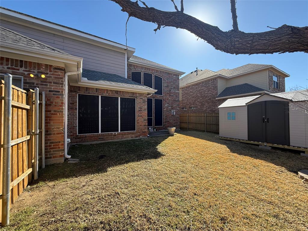 2022 Huntcliffe Court Allen, TX 75013 - Photo 36 of 40 Fenced backyard with a shed