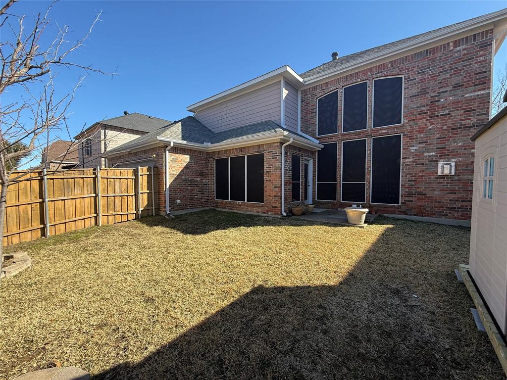 2022 Huntcliffe Court Allen, TX 75013 - Photo 37 of 40 Rear view of property with brick siding, a fenced backyard, and a patio