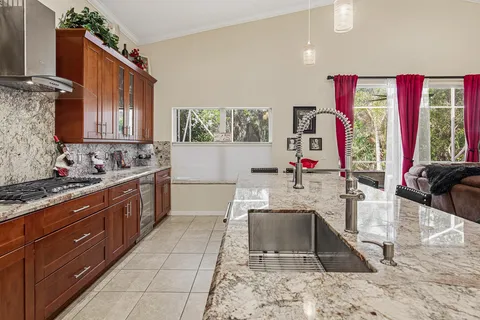 a living room with furniture kitchen and a window