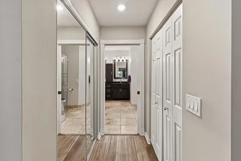 a bathroom with a sink vanity and mirror