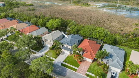 an aerial view of residential houses with outdoor space
