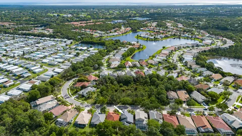 an aerial view of city and lake