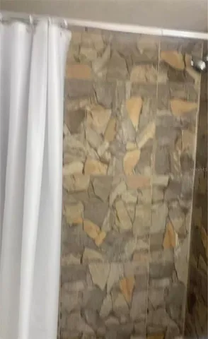 a kitchen with stainless steel appliances granite countertop a sink and a refrigerator