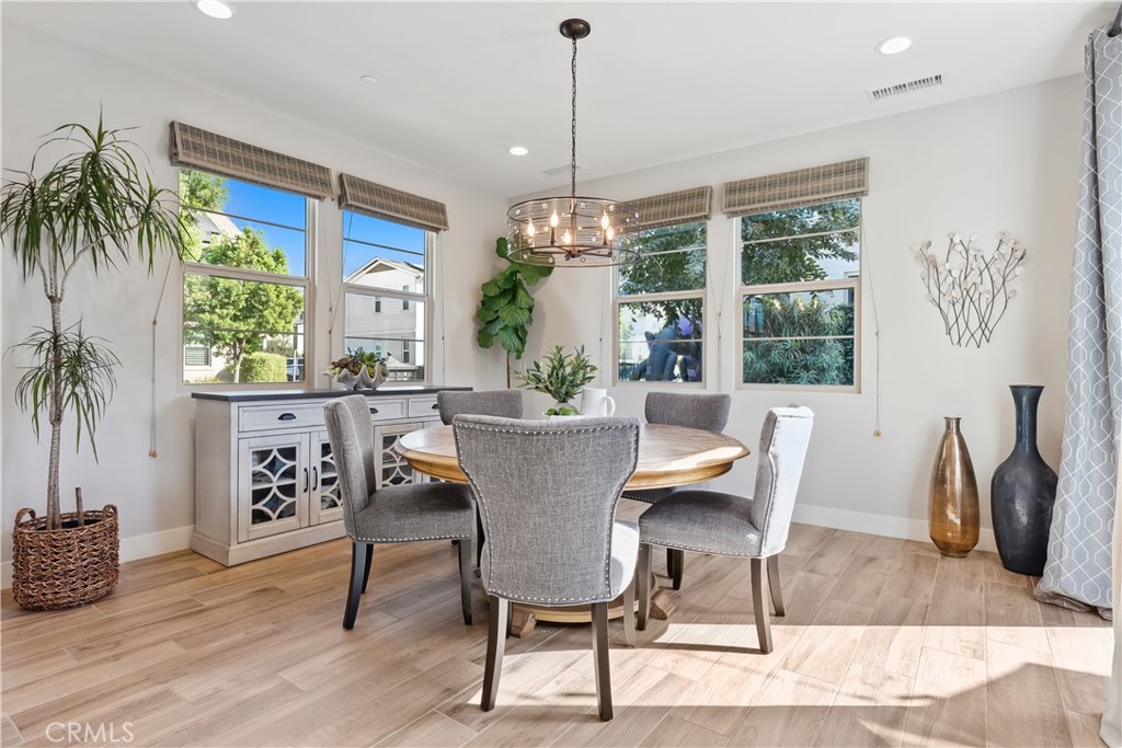 27 Alienta Lane Rancho Mission Viejo, CA 92694 - Photo 11 of 75 a view of a dining room with furniture window and wooden floor