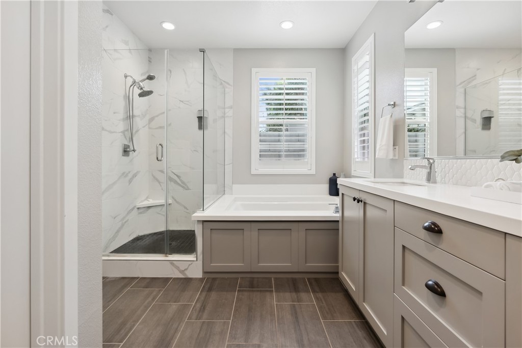27 Alienta Lane Rancho Mission Viejo, CA 92694 - Photo 18 of 75 a bathroom with a tub sink and mirror